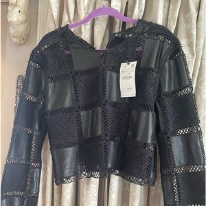 Zara top -color is black -size extra large. It’s more like a medium or large.